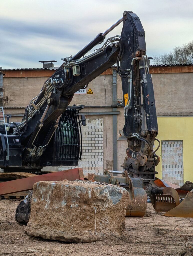 Bakhita Construction — Heavy excavator at construction site